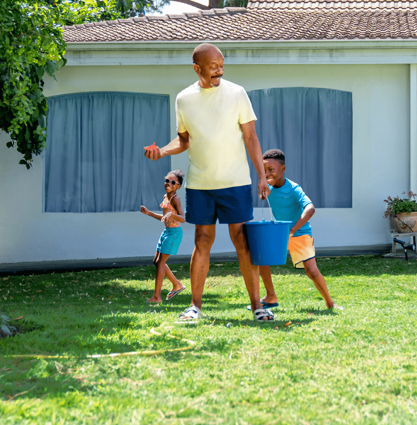 Parent playing outside with kids