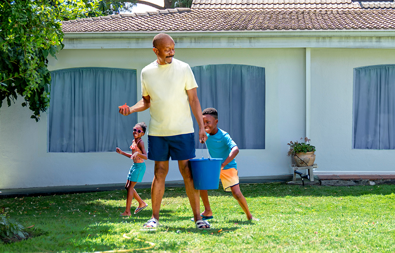 Parent playing outside with kids