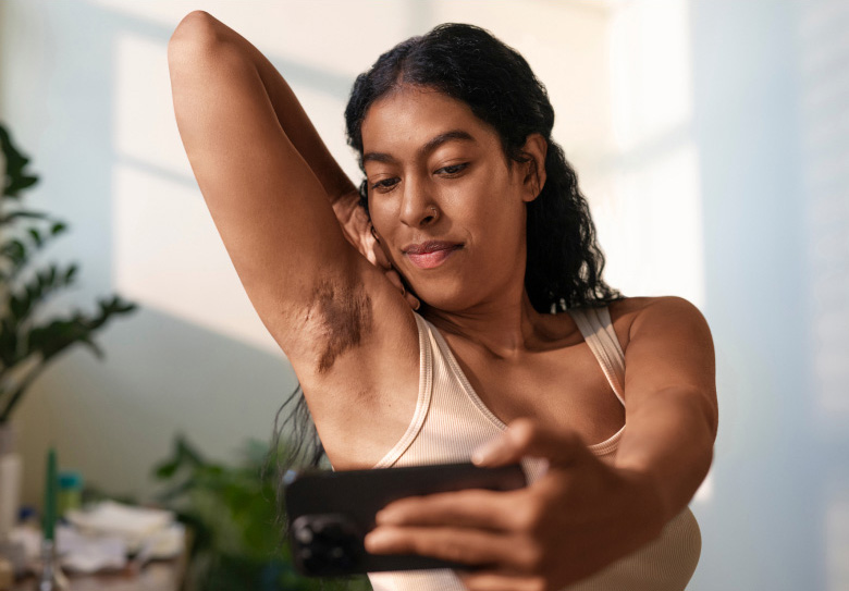 Person self examining HS symptoms on skin