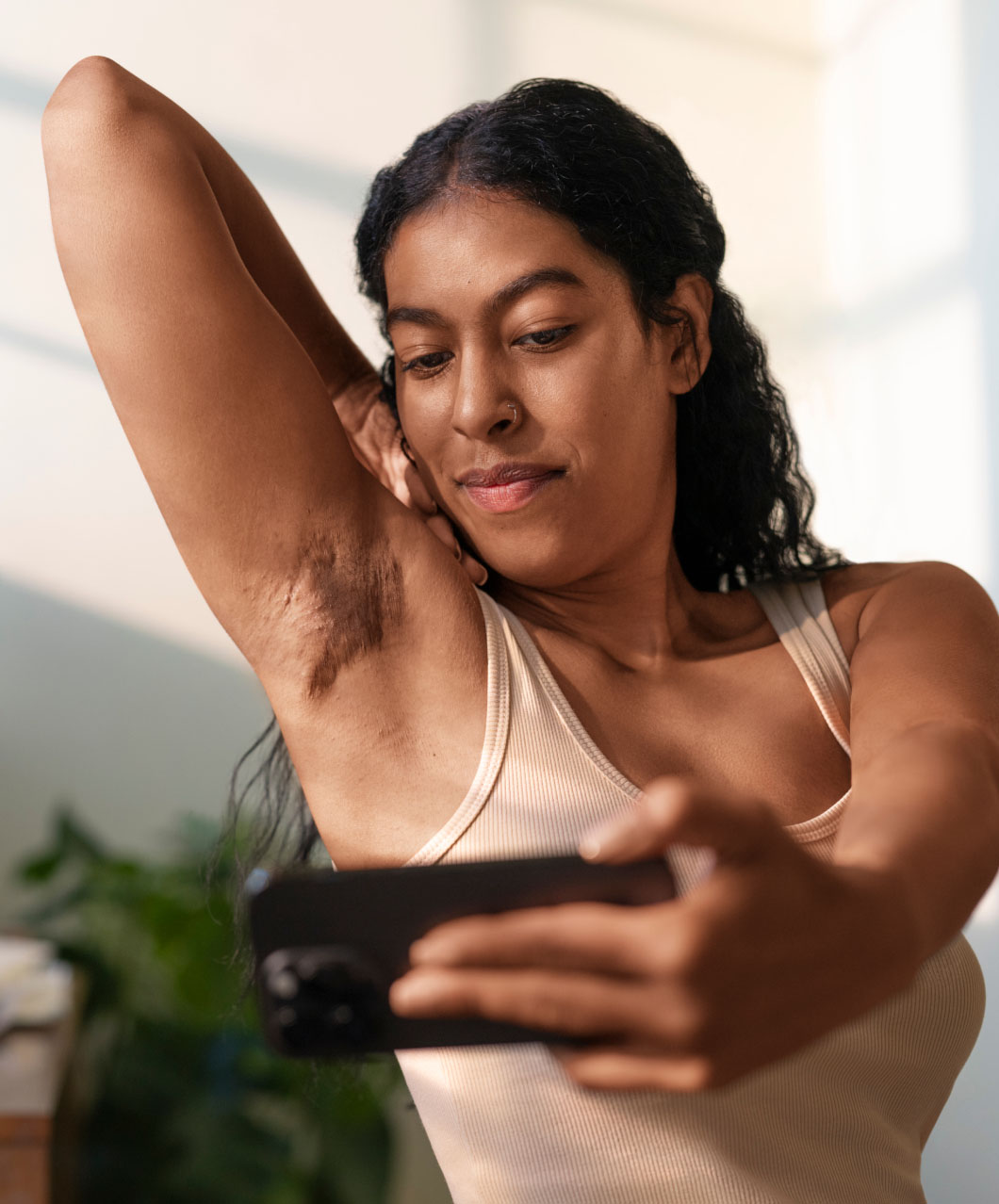 Person self examining HS symptoms on skin